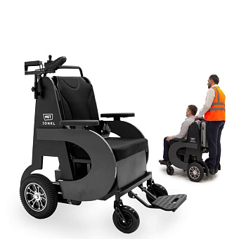 Электрическое кресло-коляска для аэропортов, вокзалов, парков, торговых центров, санаториев и других коммерческих или государственных учреждений, черного цвета